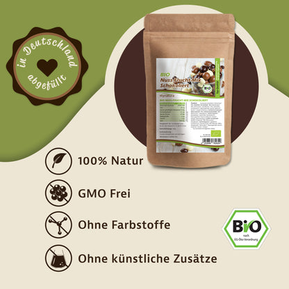 Beutel Mynatura Bio Nuss-Fruchtmischung schokoliert auf grün-beigem Hintergrund, daneben Icons und Hinweise zu natürlichen Zutaten und Verzicht auf Zusätze.
