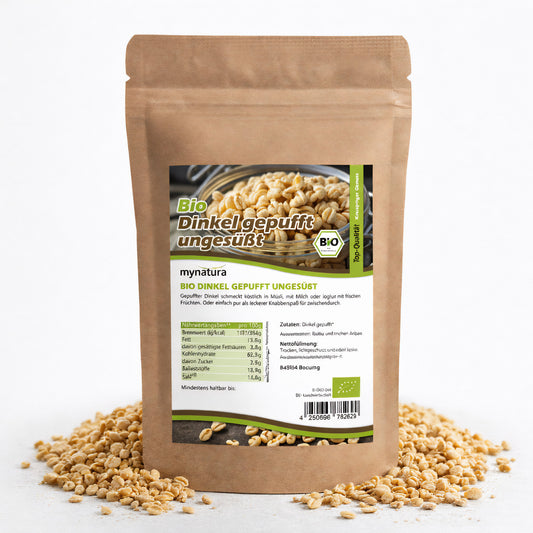 Beutel Bio Dinkel gepufft ungesüßt mit sichtbaren gepufften Dinkelkörnern, einige Körner als knusprige Snack-Idee rund um die Verpackung verstreut.