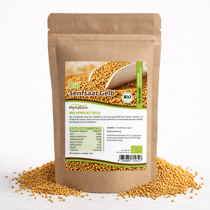 Beutel Mynatura Bio Senfsaat gelb, stehend auf verstreuten gelben Samen, Vorderseite mit Etikett und Nährwertangaben, geeignet für Gewürze, Saucen und Backen.