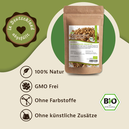 Beutel Mynatura Bio Galgantwurzel geschnitten 100g auf grünem Hintergrund, daneben Symbole und Hinweise zu natürlichen Kräuter-Eigenschaften.