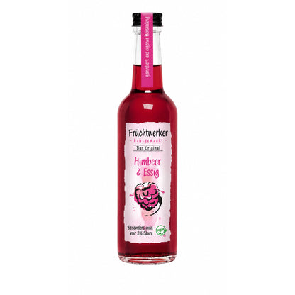 Fruchtwerker Himbeer & Essig 250ml in einer klaren Glasflasche mit pinkfarbenem Etikett und schwarzem Schraubverschluss, freigestellt vor weißem Hintergrund.